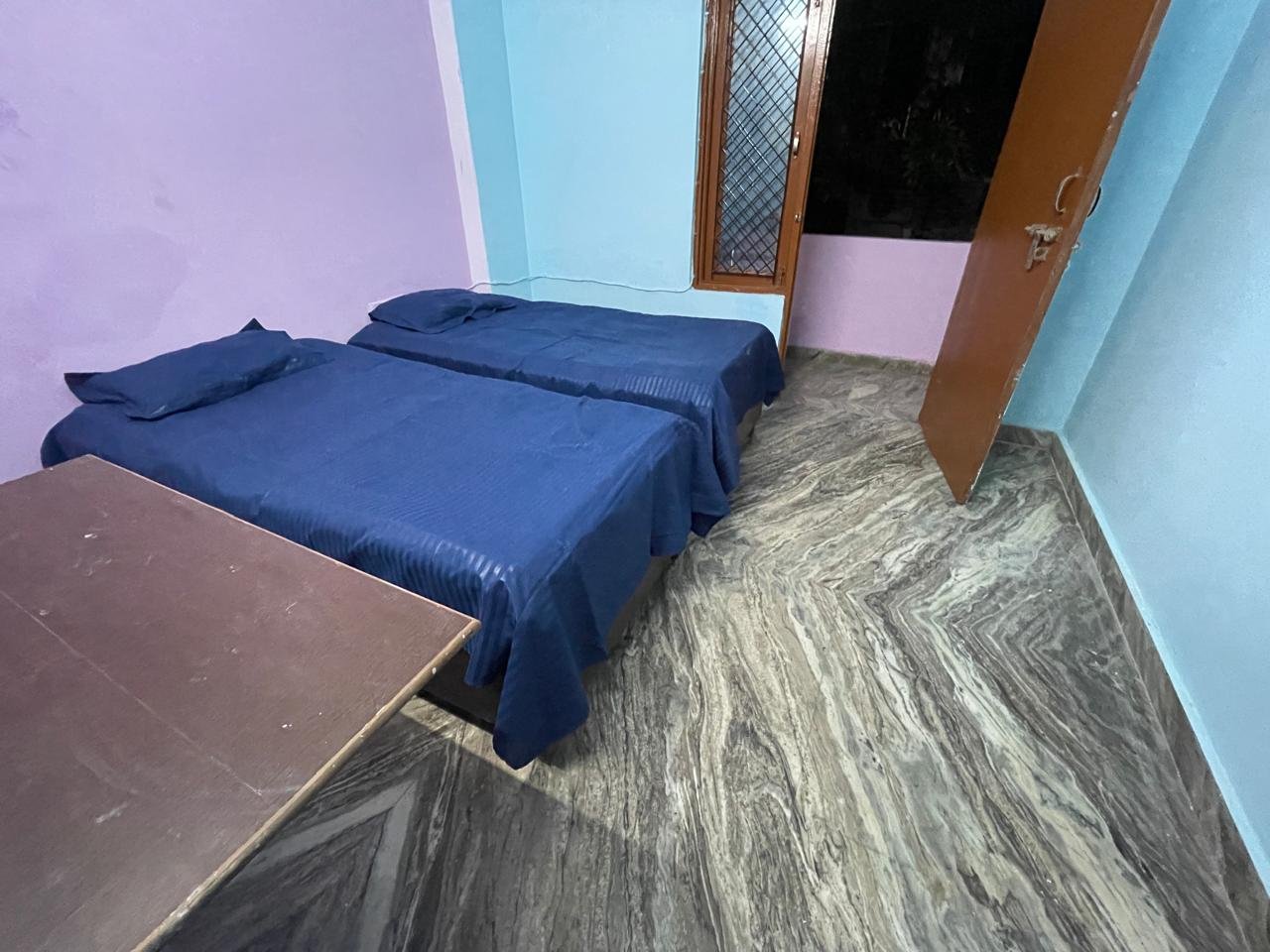 Double bed room interior at Sunrise Girls PG Delhi