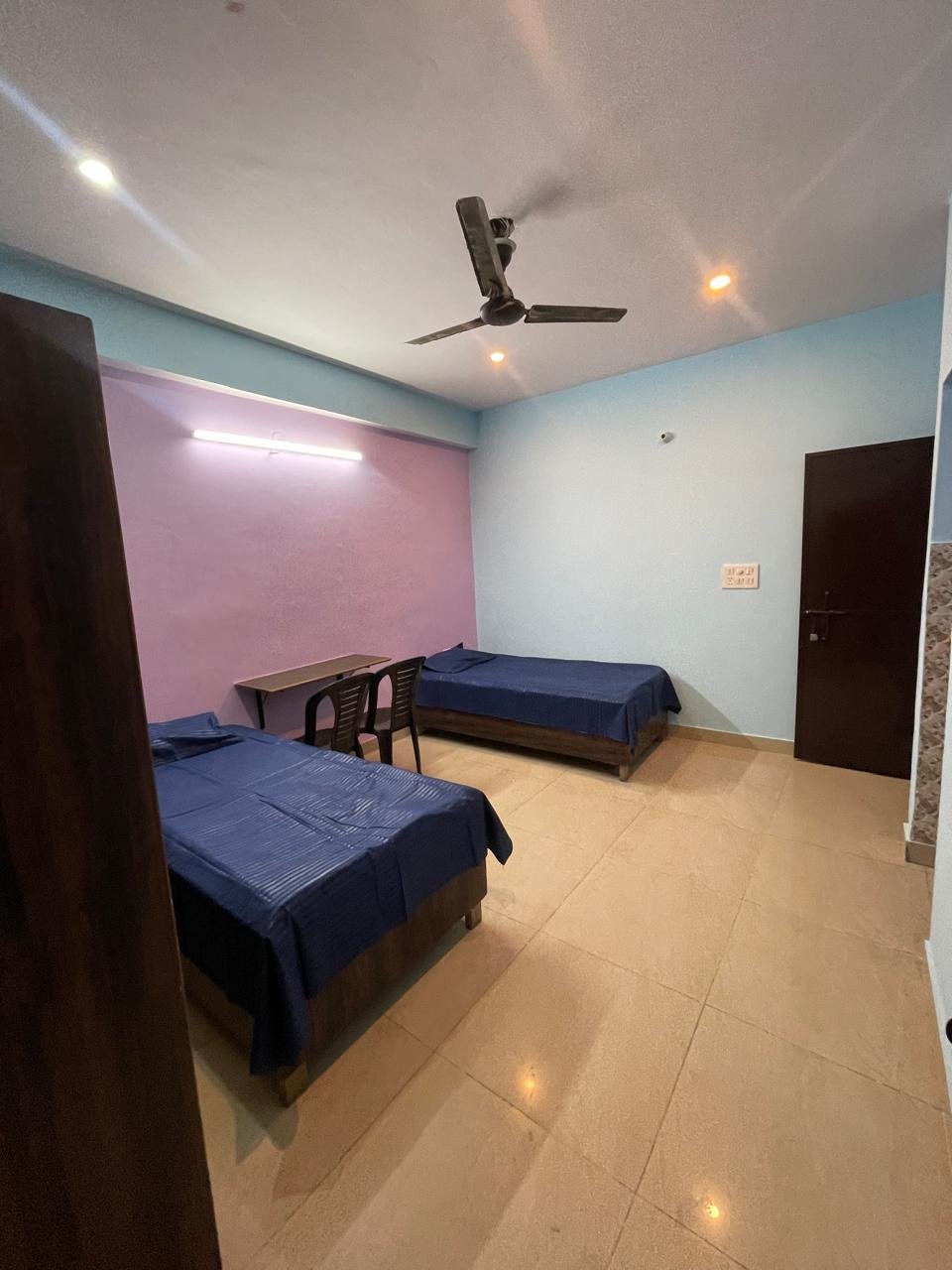 Triple sharing room at Sunrise Girls PG Ashok Vihar